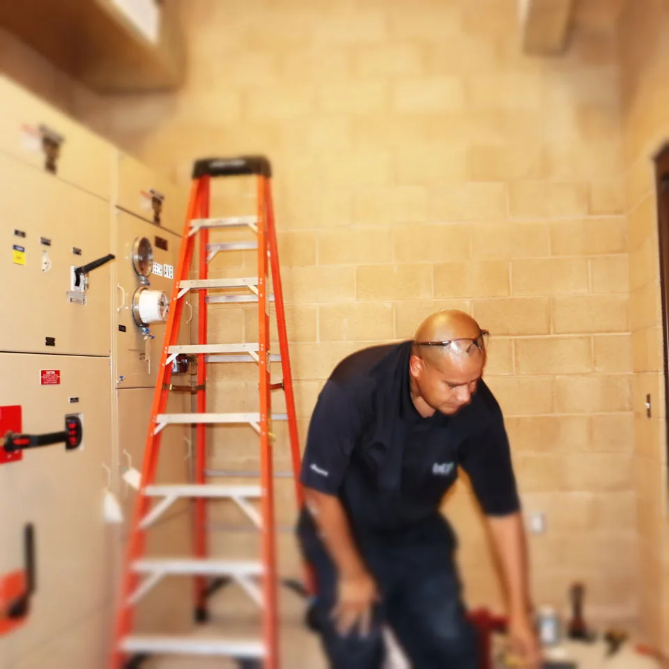 BTI technicians performing low-voltage network cabling work