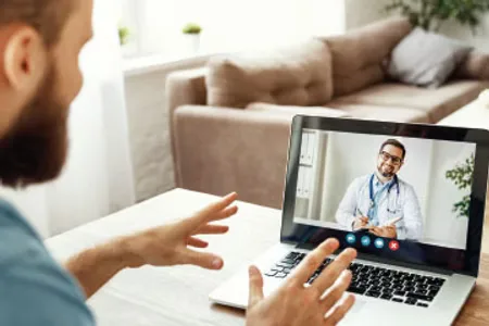 Doctor video confrencing with patient
