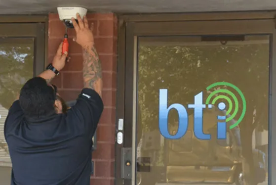 BTI technician installing Avigilon cameras at our Downers Grove office