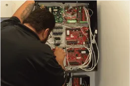 Access control panel being installed by a BTI technician