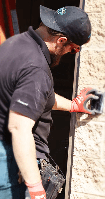 BTI security engineer servicing an existing access control system for a commercial facility