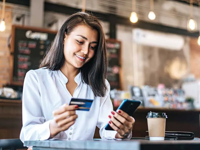 Women making a credit card payment on a PCI compliant organization.