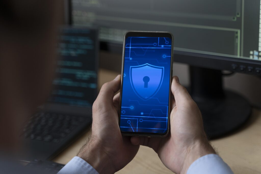 Security System Integration Services 8 close up hands holding smartphone