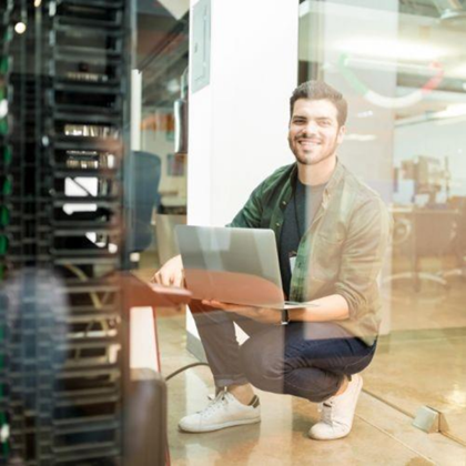 Too Much on Your IT Team’s Plate? Co-Managed IT Services Can Help 2 IT Specialist performing on site service maintenance through co-managed it service