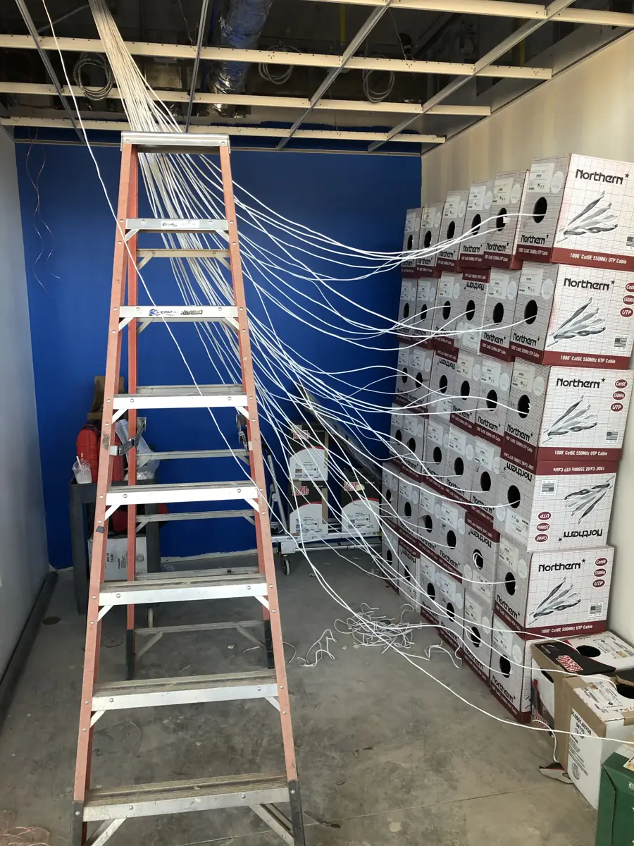 Network cabling being pulled during a BTI installation for a Chicagoland client